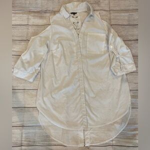 Super cute button up top with peep shoulder and fishtail back with open sides